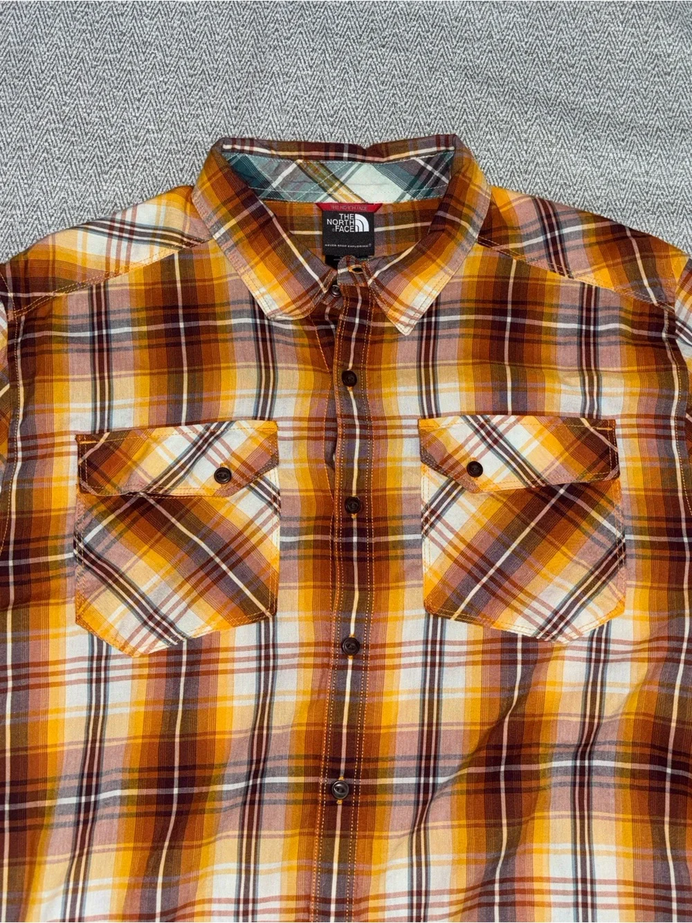 The North Face orange brown plaid short sleeve button down shirt size Large
